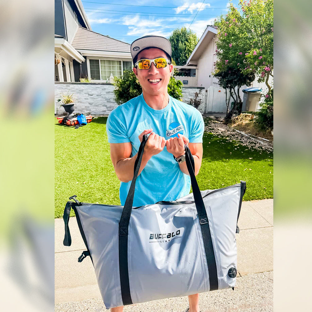 White fish cooler bag with black straps and top handles, flat bottom