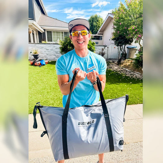White fish cooler bag with black straps and top handles, flat bottom