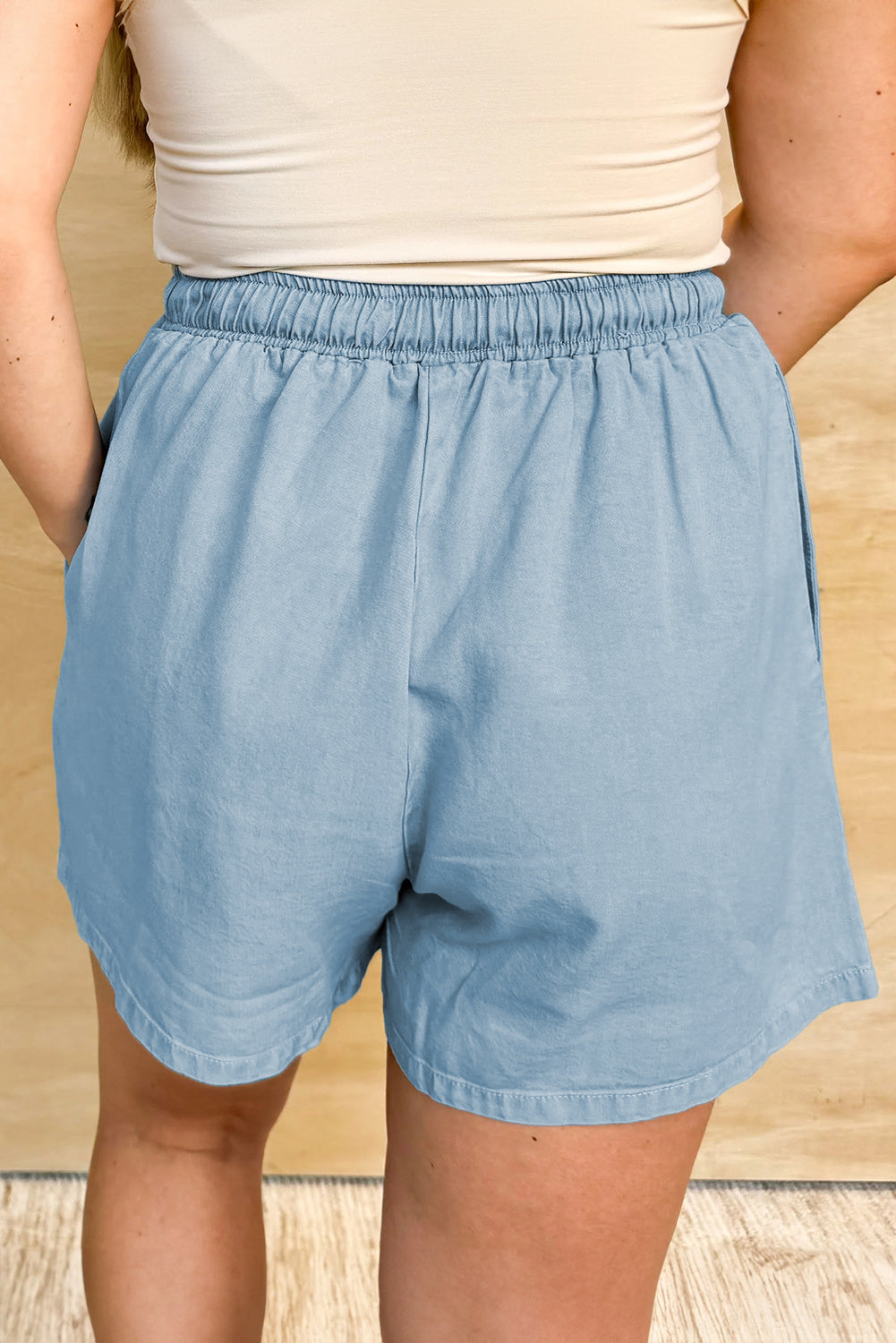 Washed chambray drawstring shorts with elastic waist and side seam pockets, blue