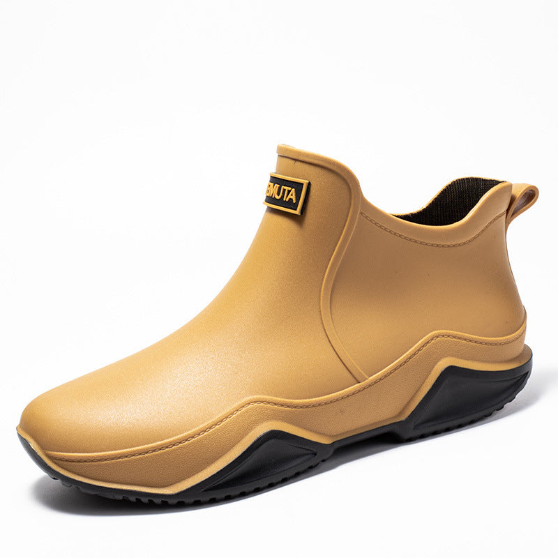 Tan low-top rubber rain boot with black outsole and thick tread