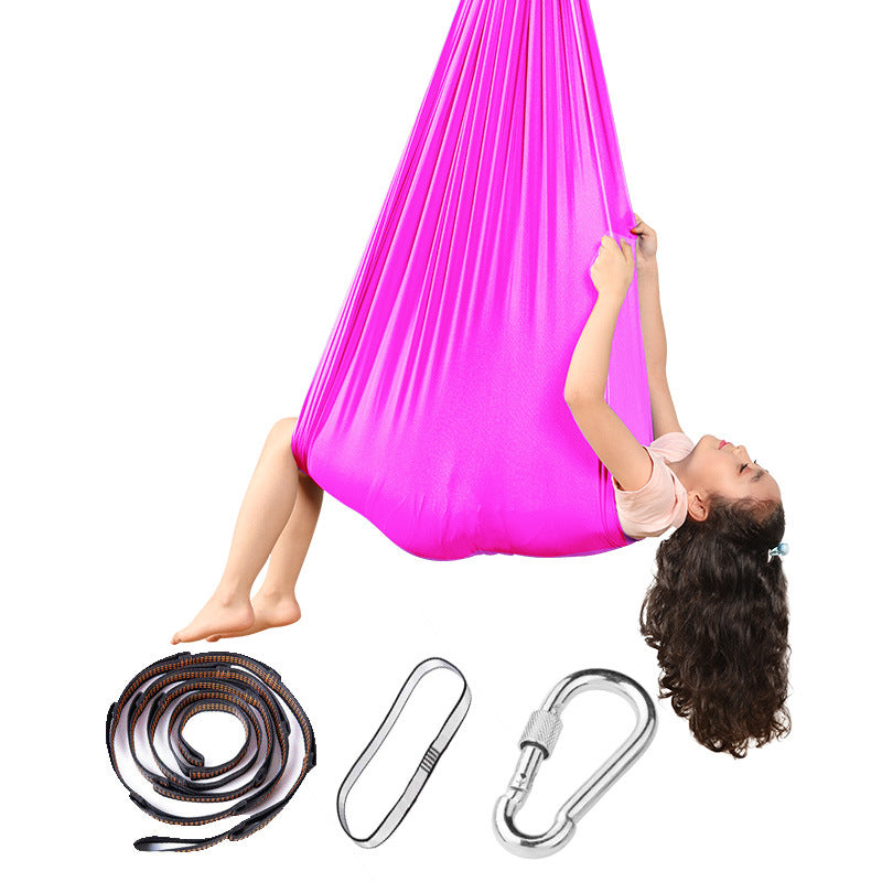 Sensory hammock swing chair in bright pink fabric with hanging rope and carabiners