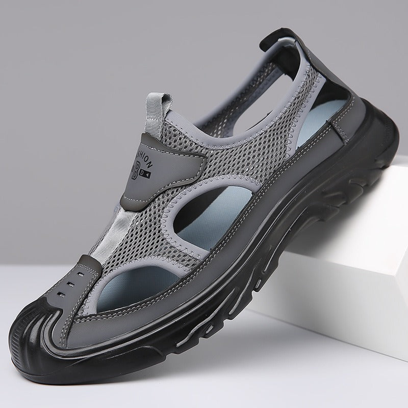 Men's gray mesh cutout sandals with padded collar and black cushioned sole