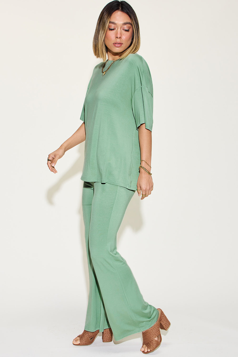 Sage drop-shoulder t-shirt and flare pants set with relaxed drape and flared legs