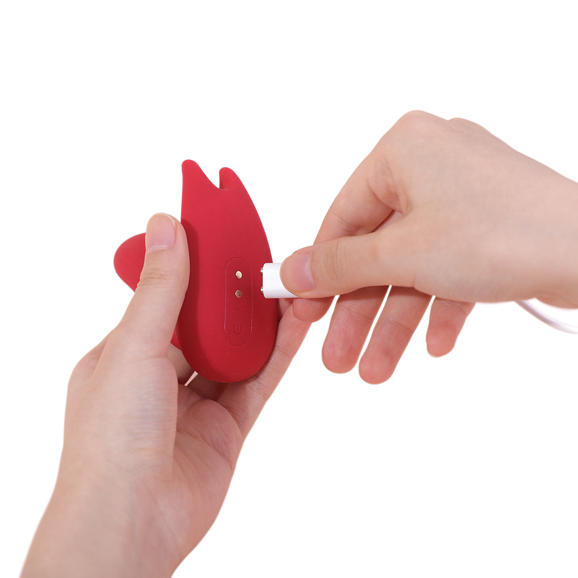 Red dual stimulation vibrator charging connector shown being plugged in