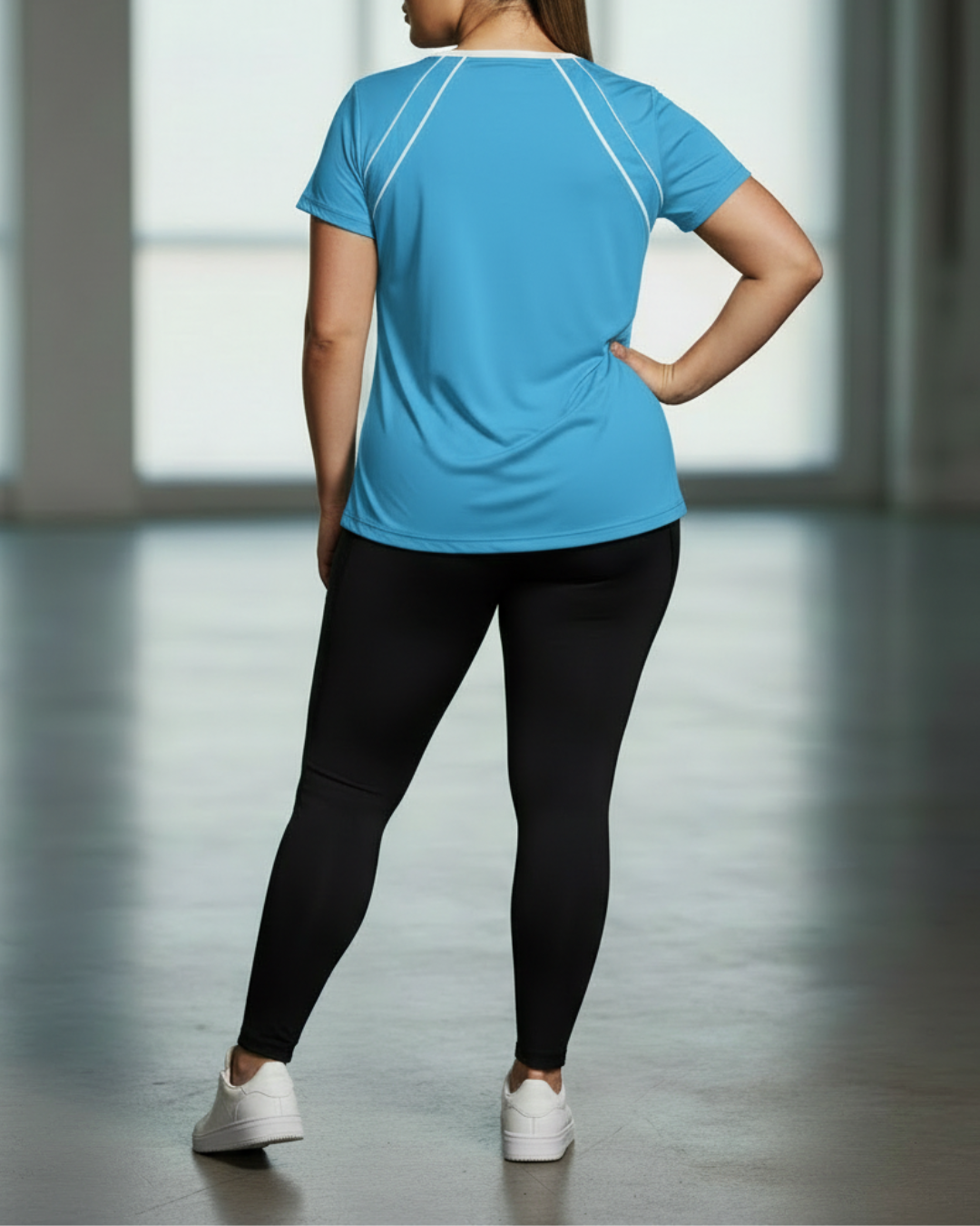 Blue sport tee back view with white contrast piping seam lines
