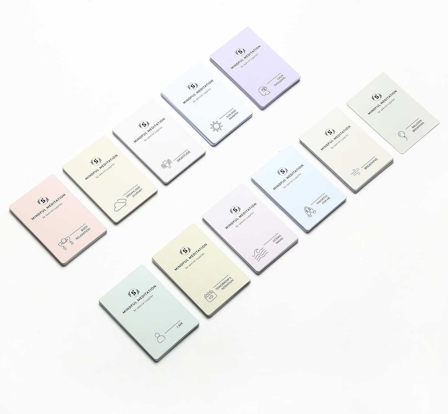 Set of mindfulness meditation cards with pastel covers in multiple colors, various icons.