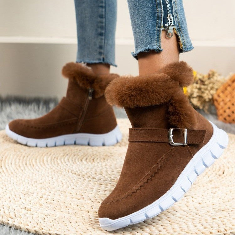Brown ankle snow boots with faux fur cuff, metal buckle strap, chunky white tread sole