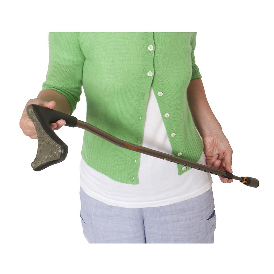 Left-handed walking cane with dark handle, brown shaft, and rubber tip