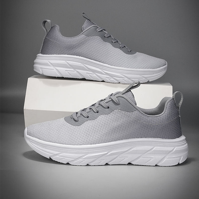 Men's mesh sneakers in light gray with lace-up front and white platform sole