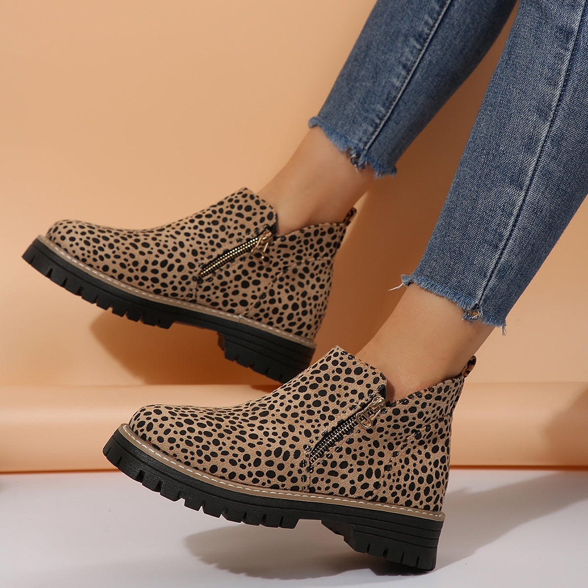 Leopard print ankle boots with side zipper and thick black lug sole