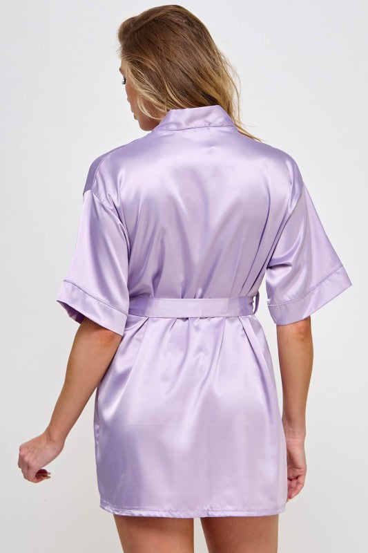 1947 Getting Ready robe, lavender satin back view with tied waist belt, short sleeves