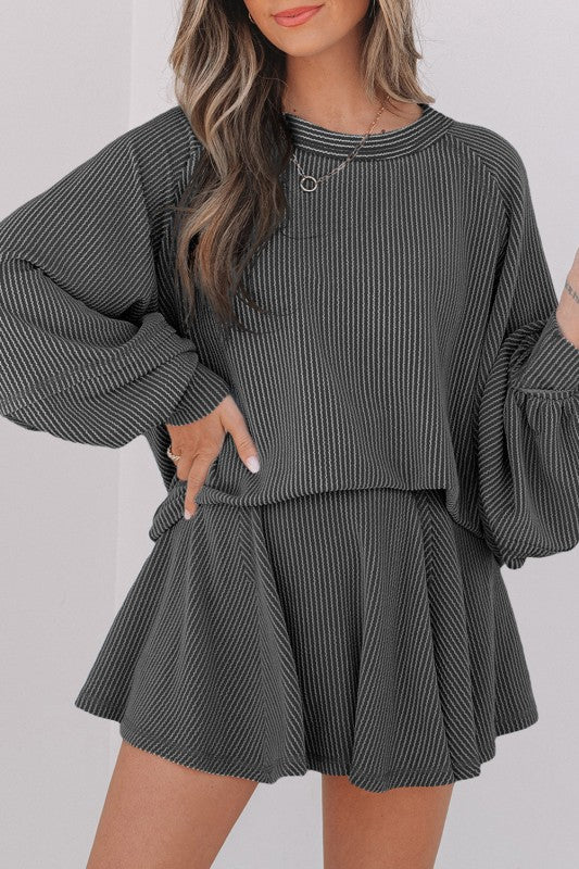 Dark gray corded top and ruffle mini skirt set, long sleeves, elastic waist, front view