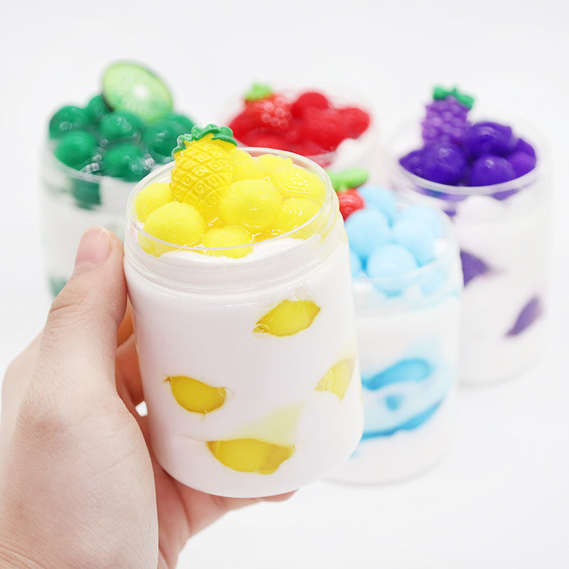 White slime cup with yellow chunks and pineapple-shaped candy topper