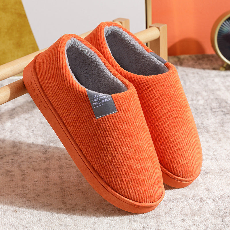 Women’s slip-on slippers, orange with fuzzy gray lining and grippy sole