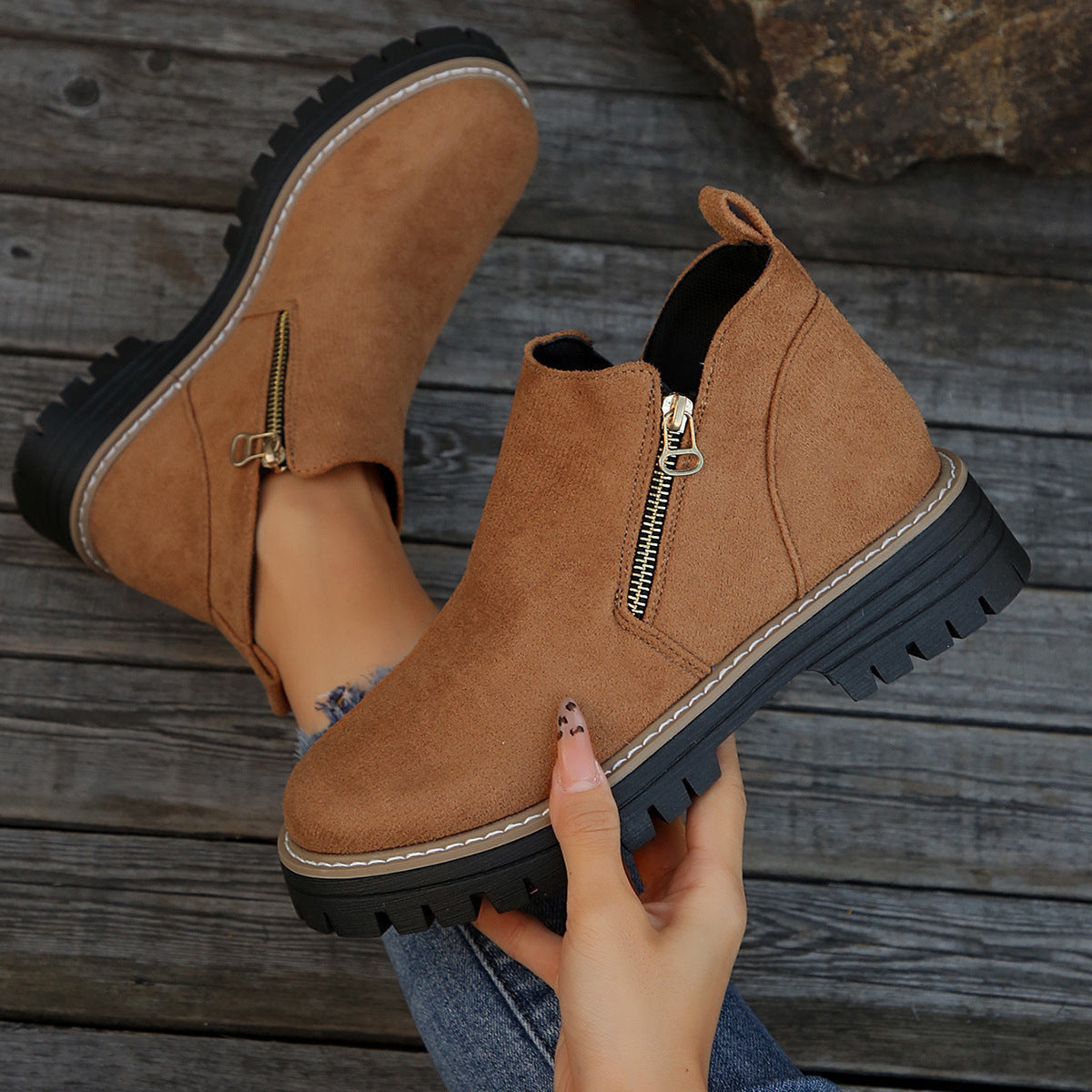 Tan suede ankle boots with side zipper and chunky black lug sole