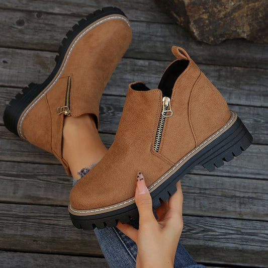 Tan suede ankle boots with side zipper and chunky black lug sole