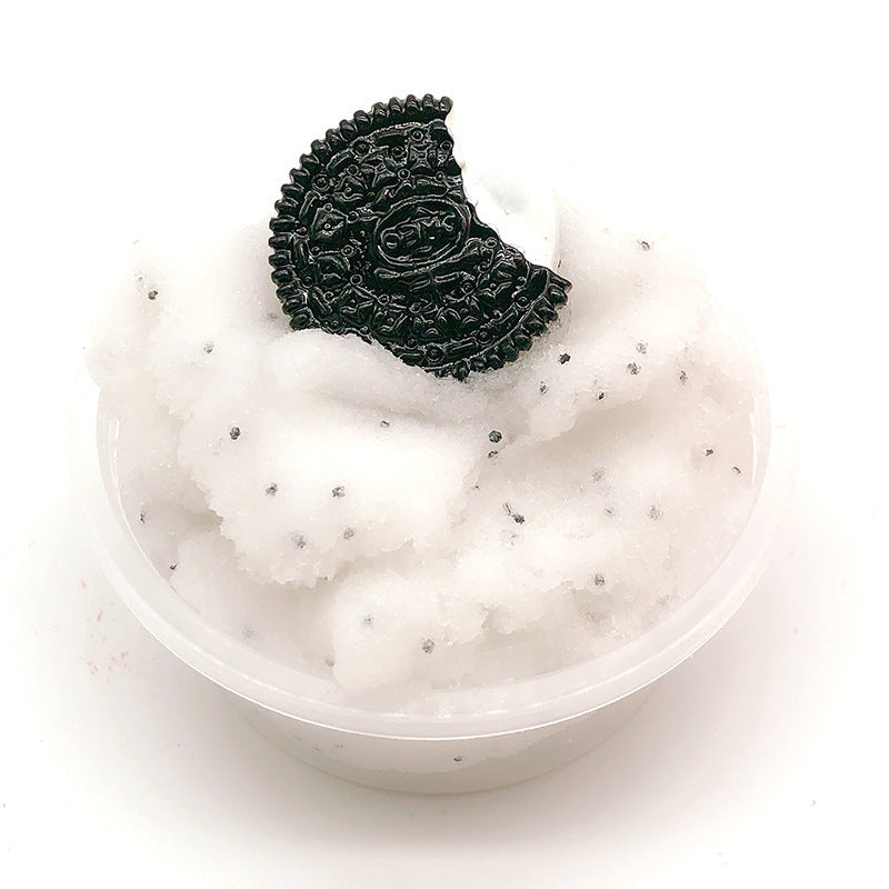 Clear slime cup with dark green textured animal-face topping