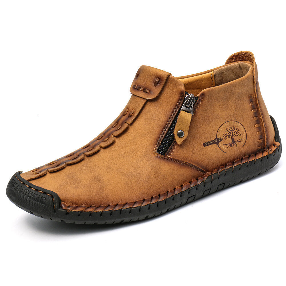 Tan men's ankle boots with side zipper, stitched leather upper and textured rubber sole