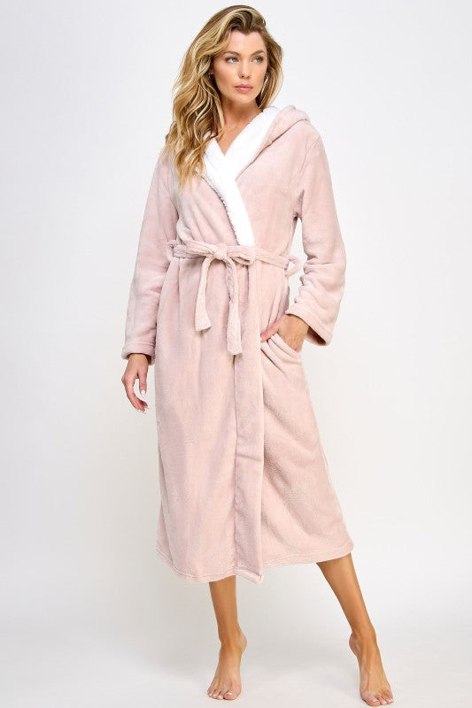Pink hooded robe with white V-neck trim, tied belt at waist, mid-calf length