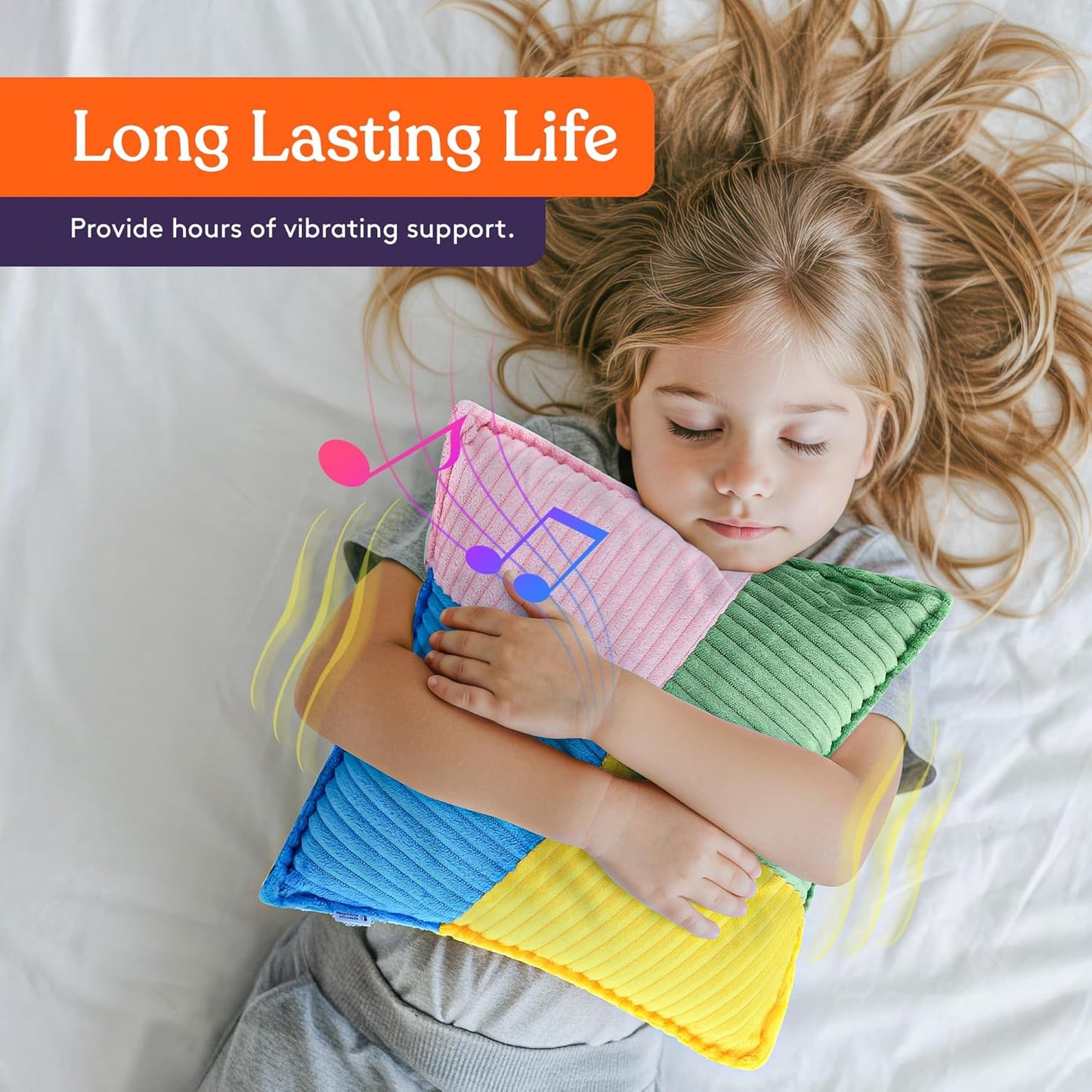 Rainbow striped plush sensory vibrating pillow hugged by a child