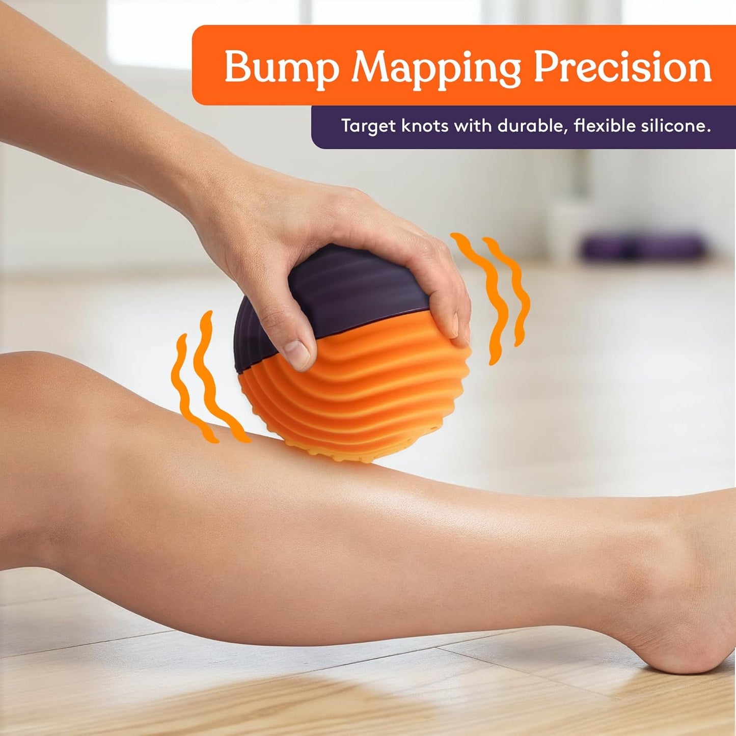 Orange and purple vibration massage ball massaging an arm