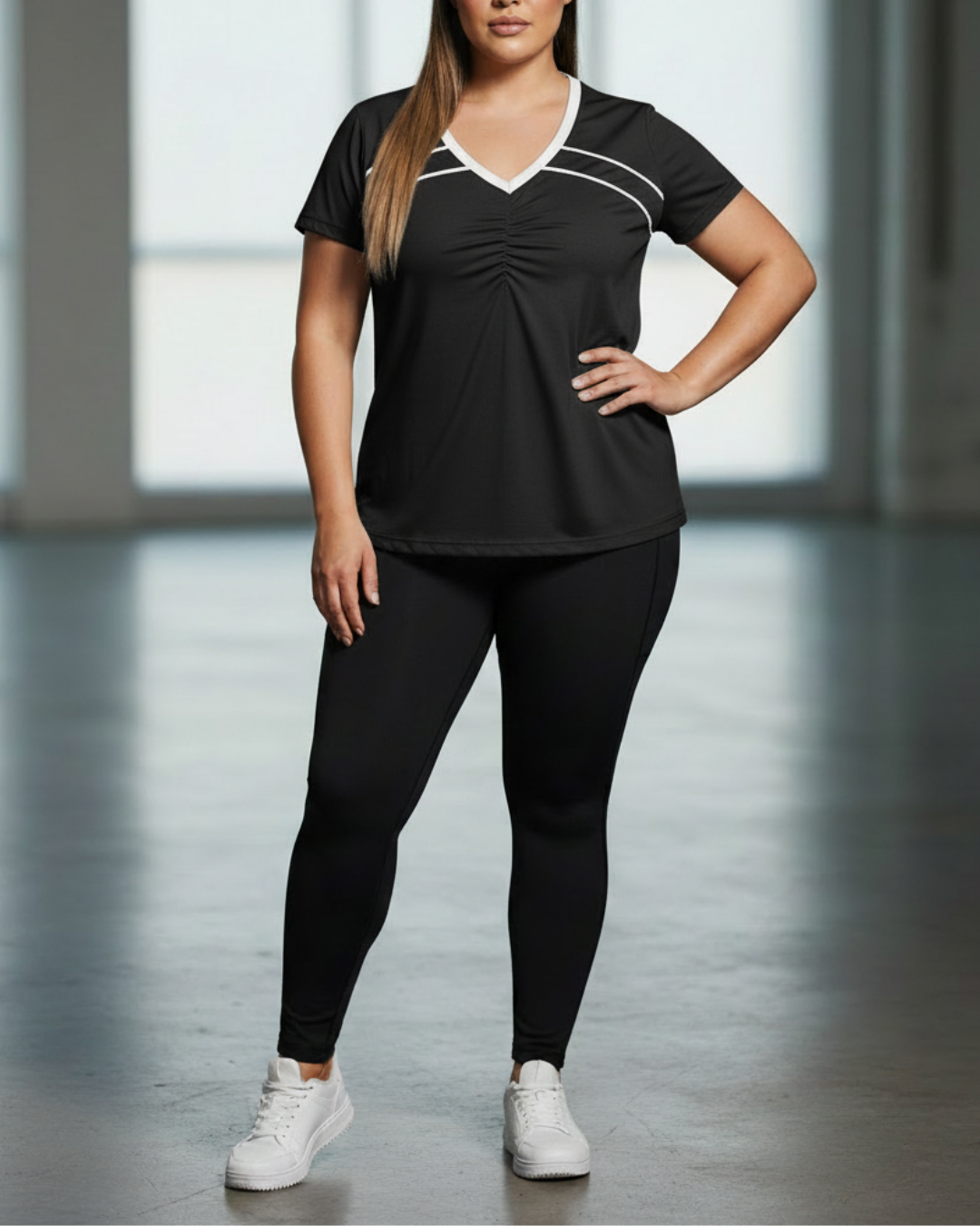Black sport V-neck tee with white contrast piping and ruched front