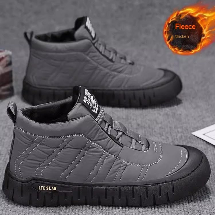 Gray high-top lace-up winter boots with quilted panels and deep tread outsole