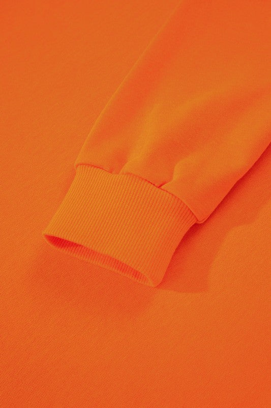 Varsity stripe pullover ribbed cuff on orange knit sleeve