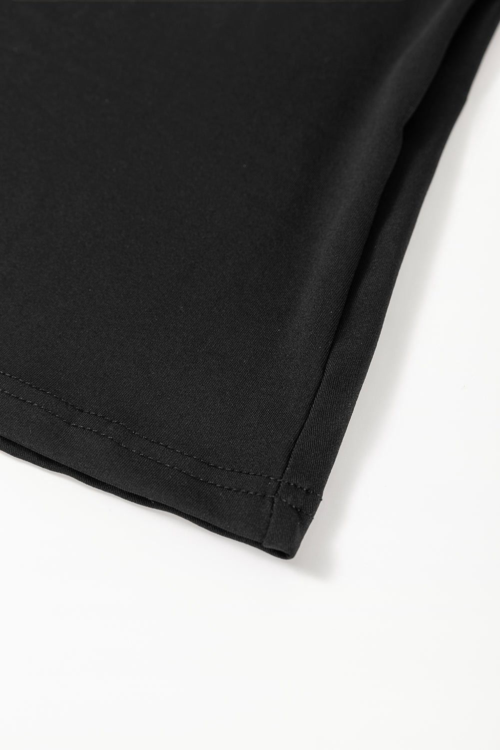 Black flared midi dress hem with stitched edge