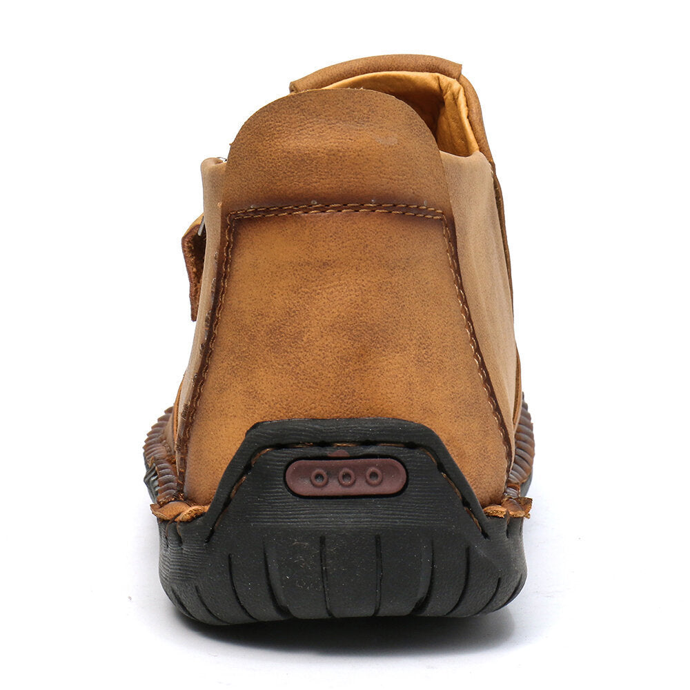 Tan men's ankle boots heel view, rubber outsole with grip texture