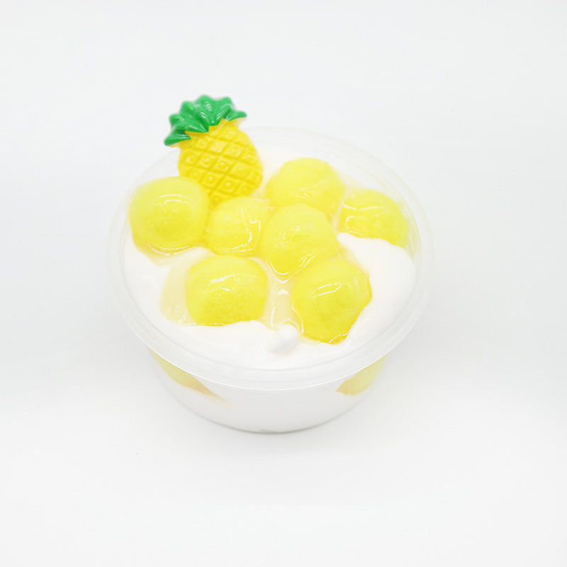 White slime cup with yellow chunks and pineapple-shaped candy topper