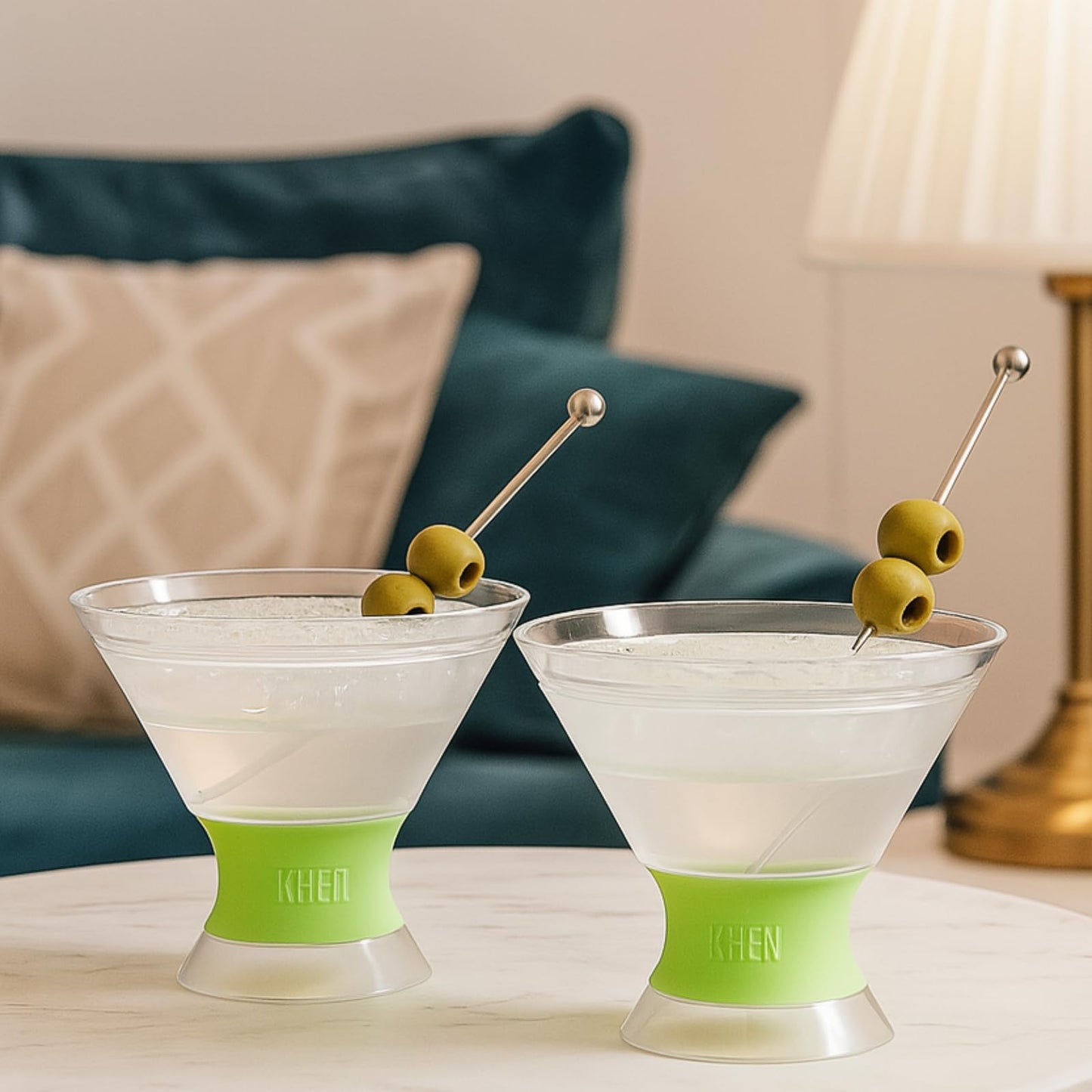 Set of 2 martini glasses with lime frosted bases and olive-skewer garnish