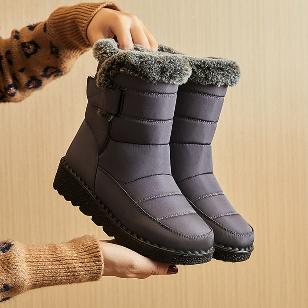 Grey snow boots with faux-fur cuff, hook-and-loop strap, chunky platform rubber sole