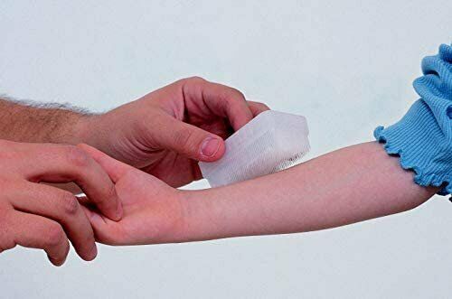 Therapressure therapy brush used on an arm, with white bristles making contact