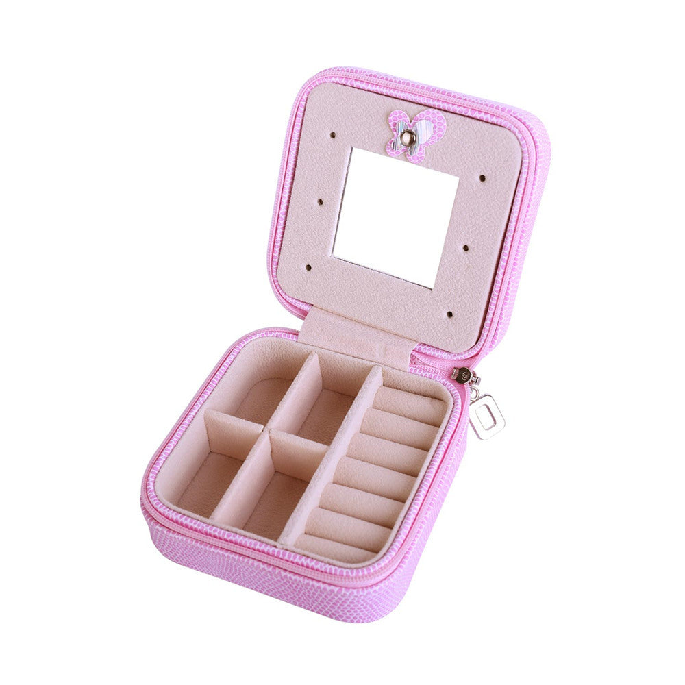 Pink jewelry organizer case opened with hinged mirror, zipper, and ring storage compartments