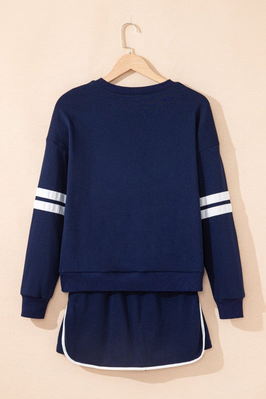 Navy mini skirt and pullover set, back view with white sleeve stripe bands.