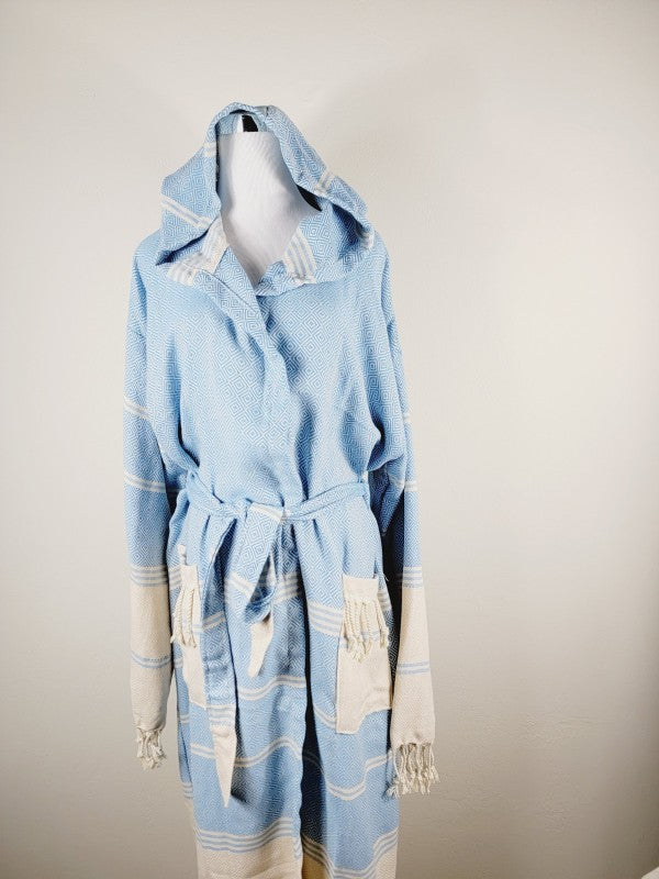 Light blue unisex hooded robe with geometric pattern, cream trim, tied waist and fringe detail