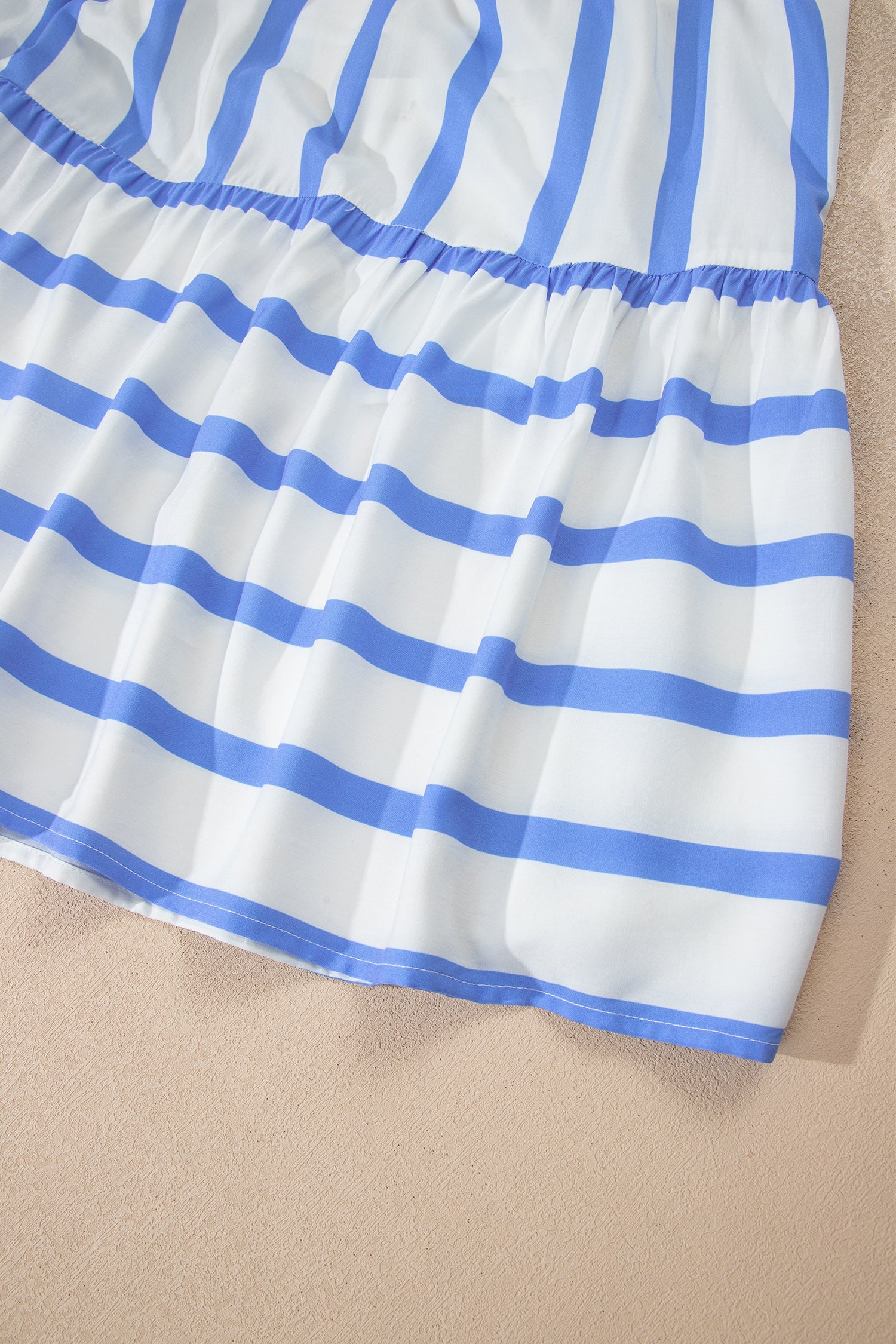 Gathered blue-and-white striped skirt with ruffled hem trim