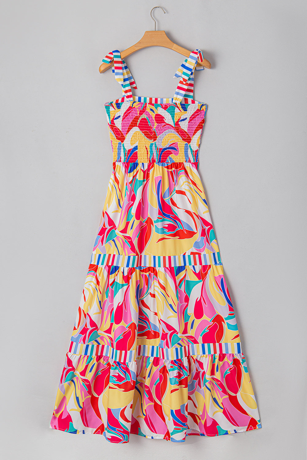 Multicolor tiered maxi sundress on hanger with bow-tie straps and striped ruffle trim