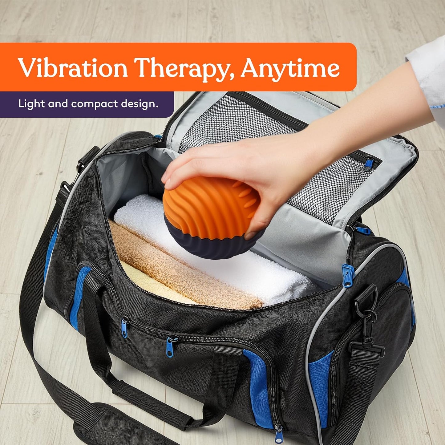 Orange and purple vibration massage ball inside a travel bag