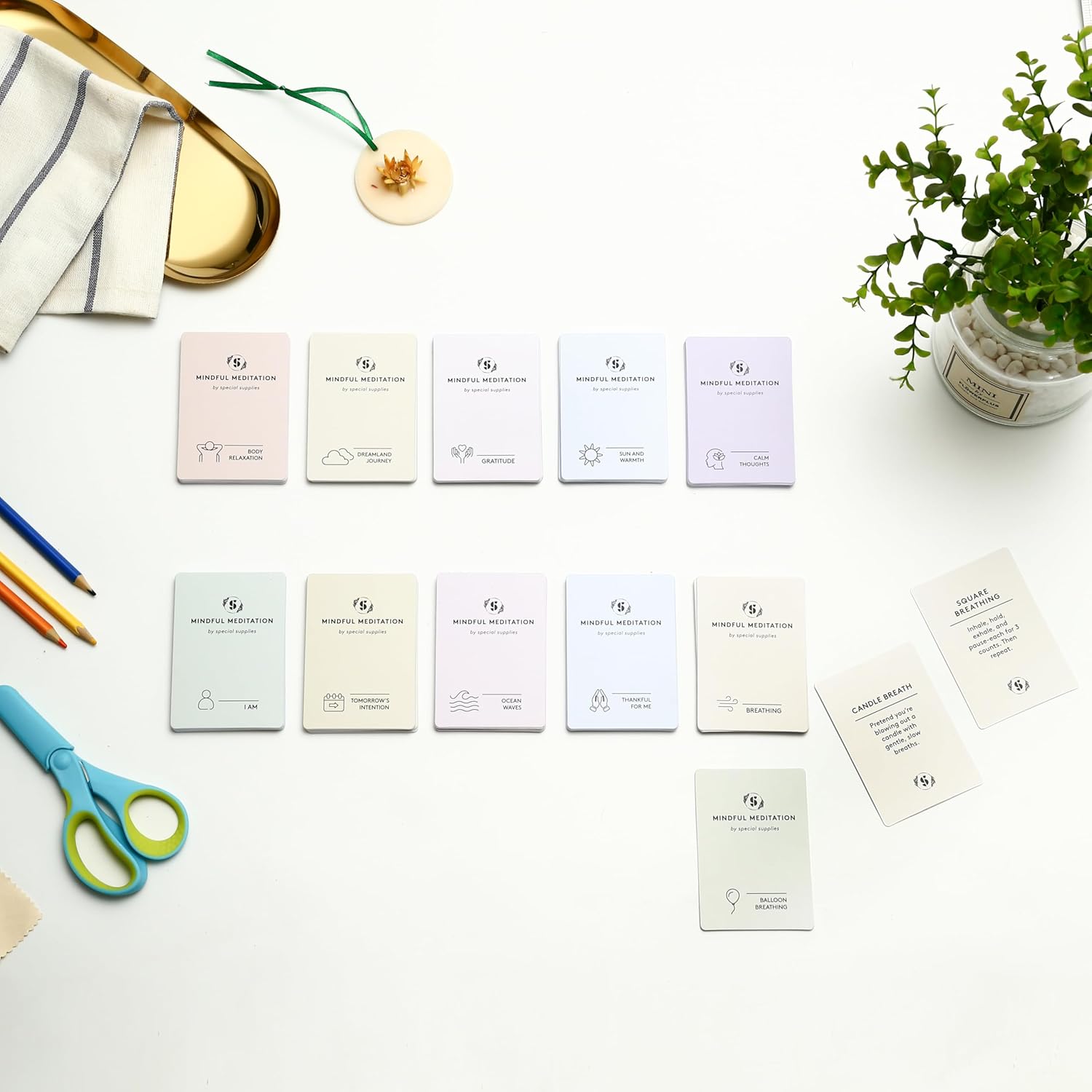 Mindfulness meditation card set displayed with several face-up cards showing icons and words.