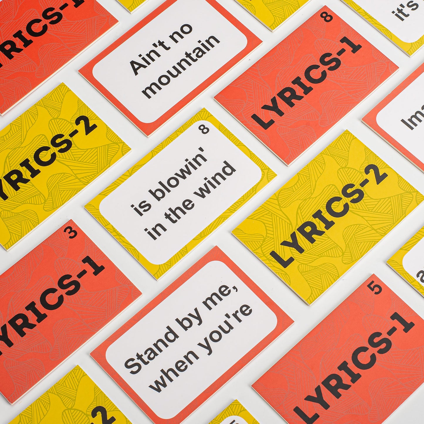 Memory match cards with lyric phrases and idioms in orange, yellow, and green