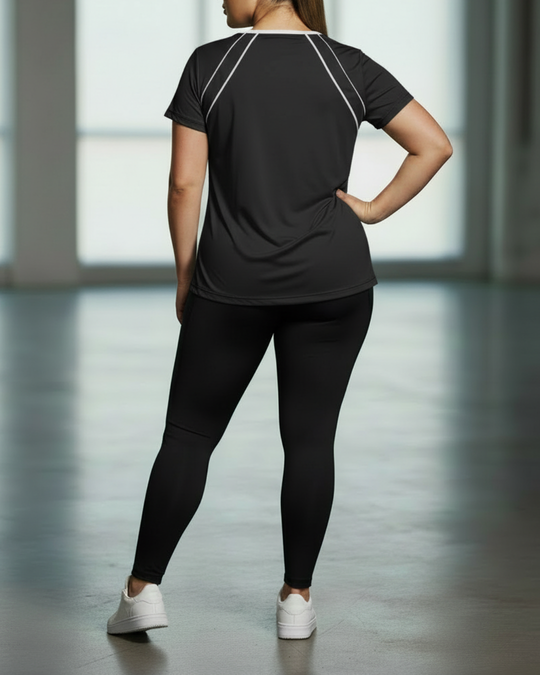 Black sport tee back view with white contrast piping seam lines