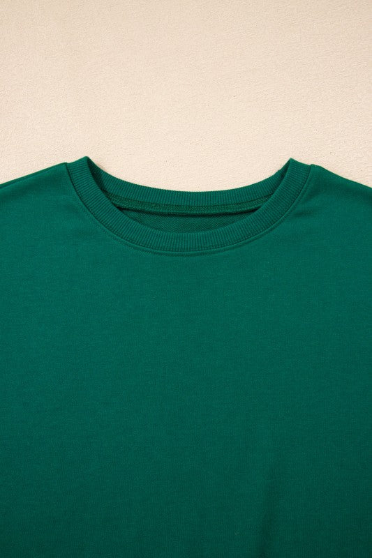 Green crewneck pullover with ribbed neckline