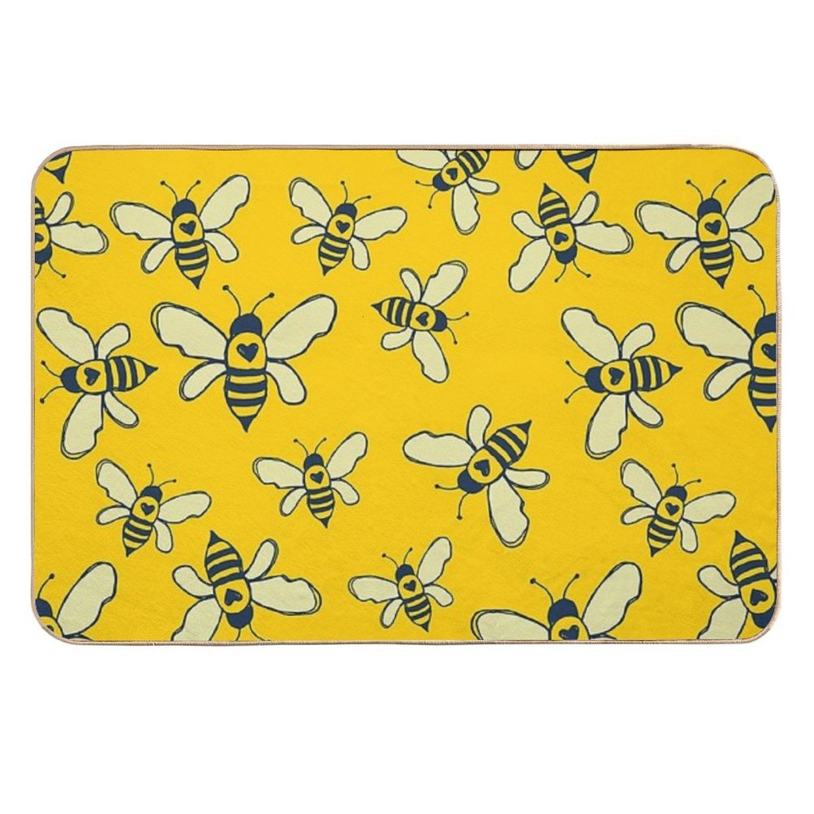 Yellow bee-themed bath mat with rounded corners, navy accents, and white wings
