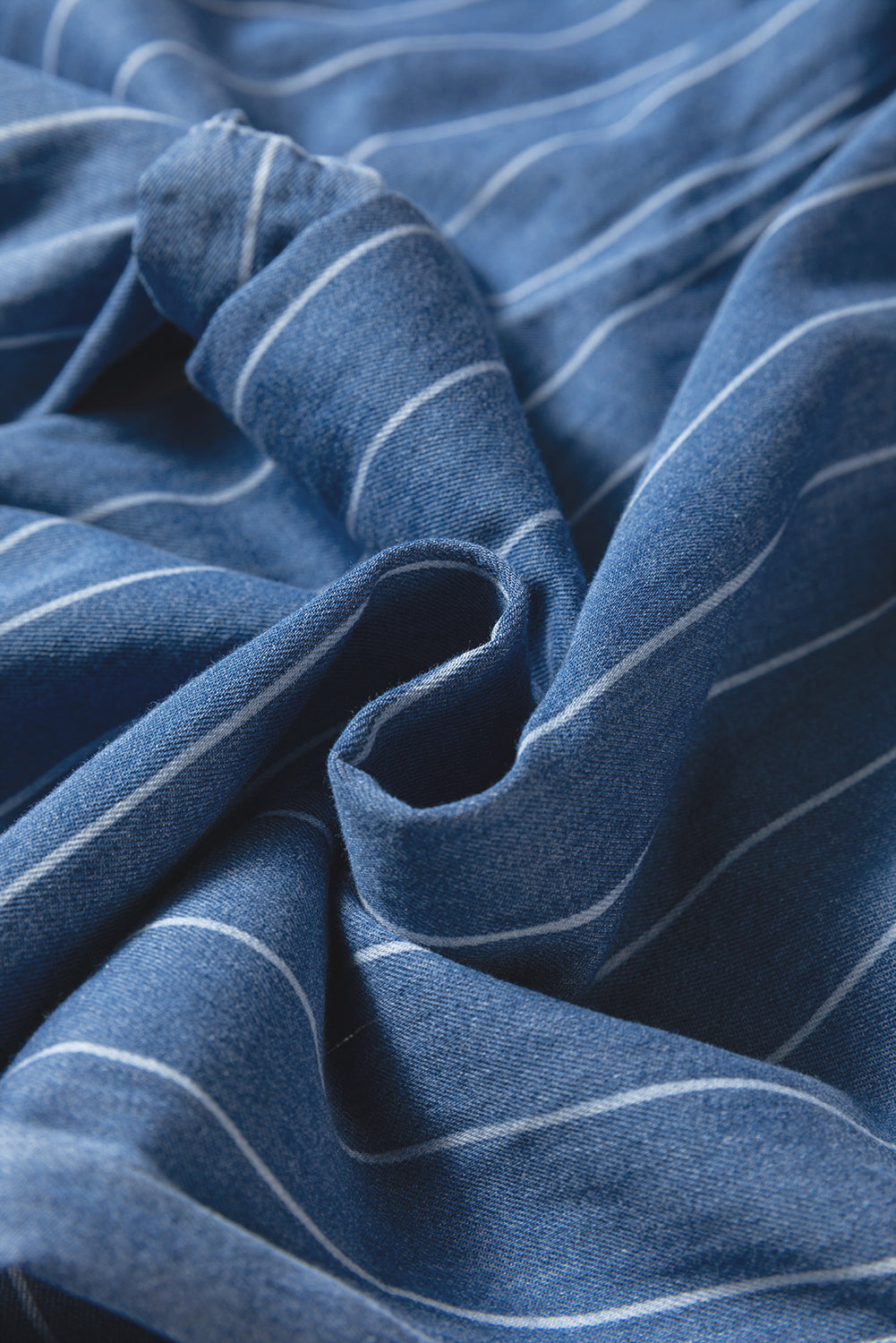 Blue pinstripe denim fabric with soft pleats and elastic-waist ruching