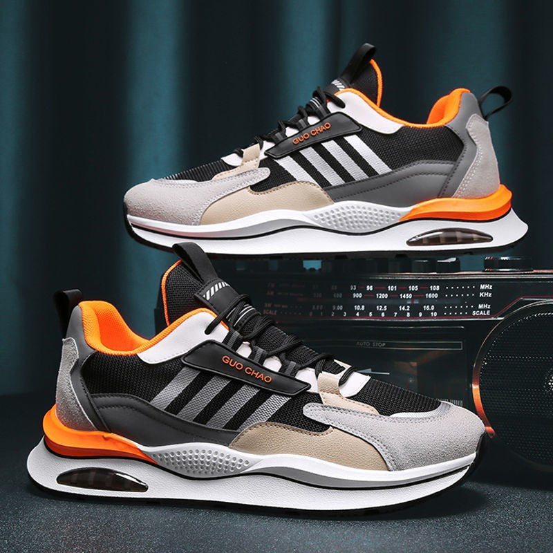 Breathable mesh sneakers in gray and black with orange trim and air-cushion sole