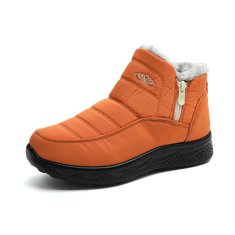 Women’s orange ankle snow boots with faux-fur lining and side zipper