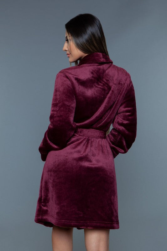 Burgundy plush robe back view with shawl collar, tie belt waist, long sleeves, short hem