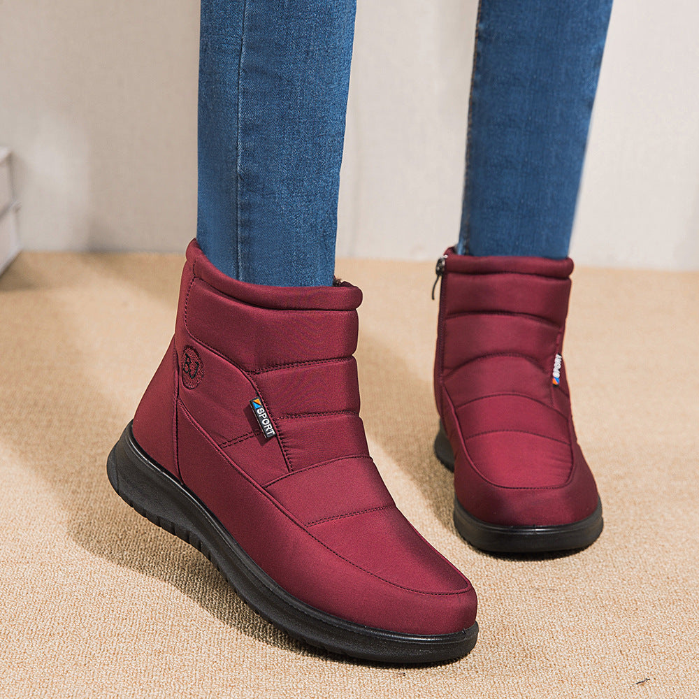 Women’s burgundy ankle boots with padded collar and black rubber sole
